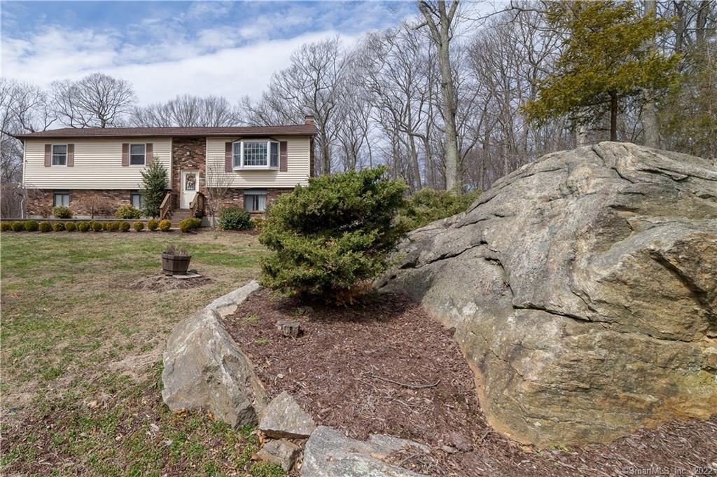 141 Mohegan Road Shelton, CT 06484 - Photo 1 of 1 a front view of house with yard and trees around