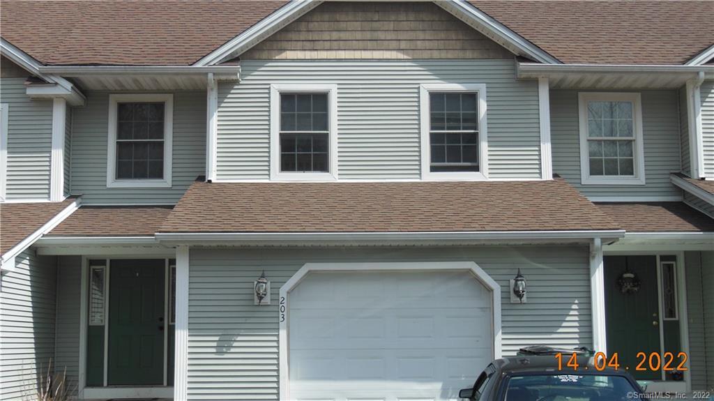 203 Brookes Landing, Unit 203 Killingly, CT 06241 - Photo 1 of 1 a front view of a house with a garage