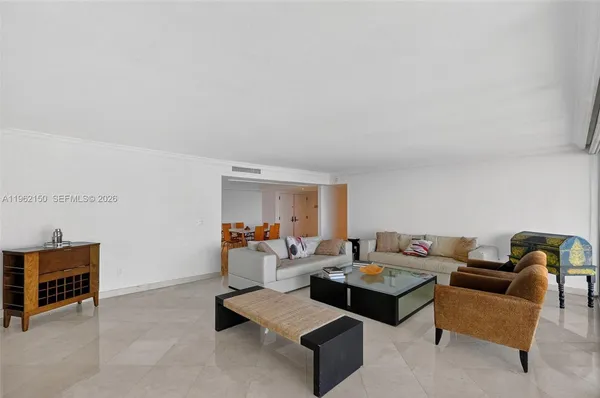a living room with furniture and a lamp with rug