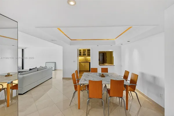 a view of a dining room with furniture and window