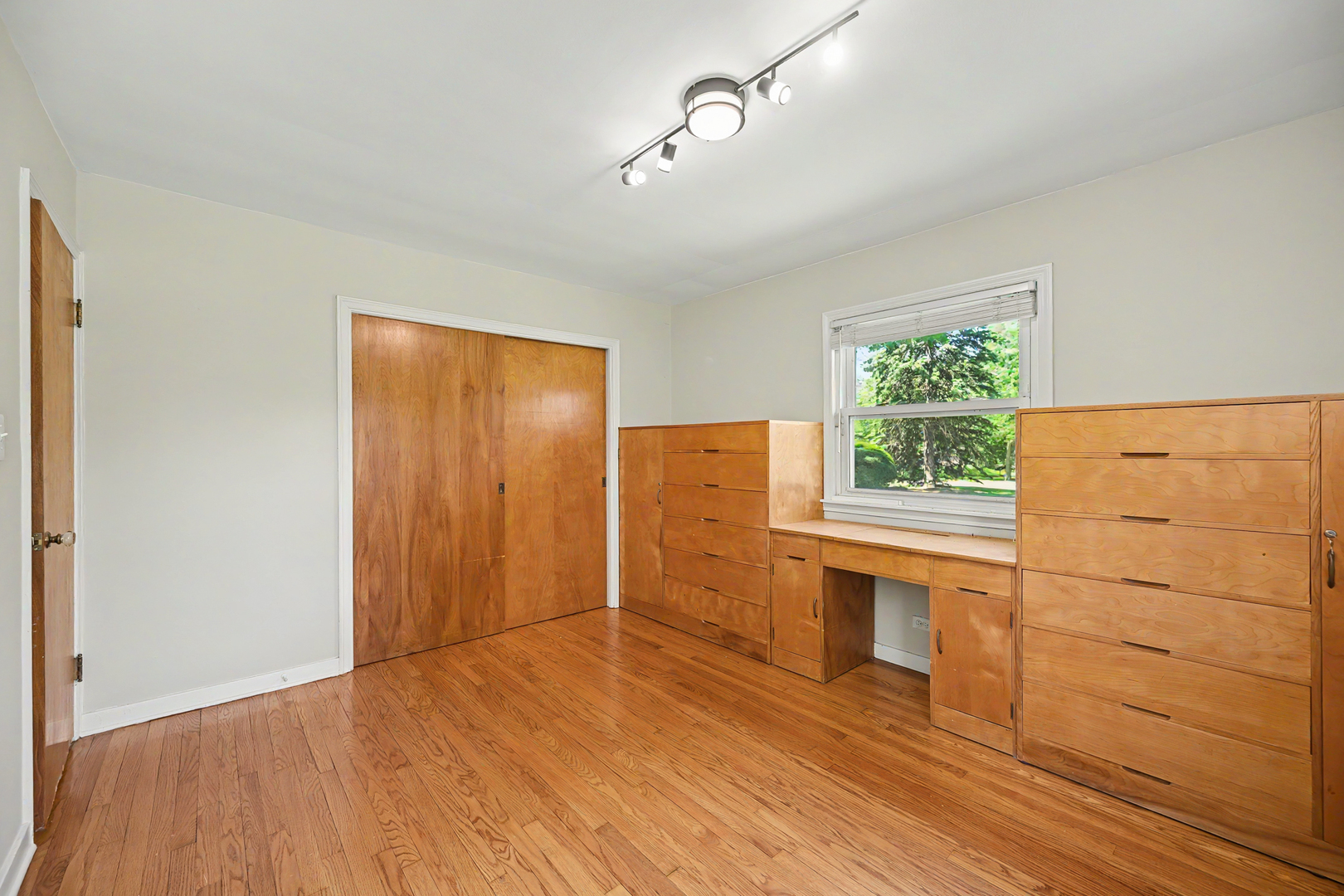 325 South Lambert Road Glen Ellyn, IL 60137 - Photo 19 of 32 wooden floor in an empty room with a window
