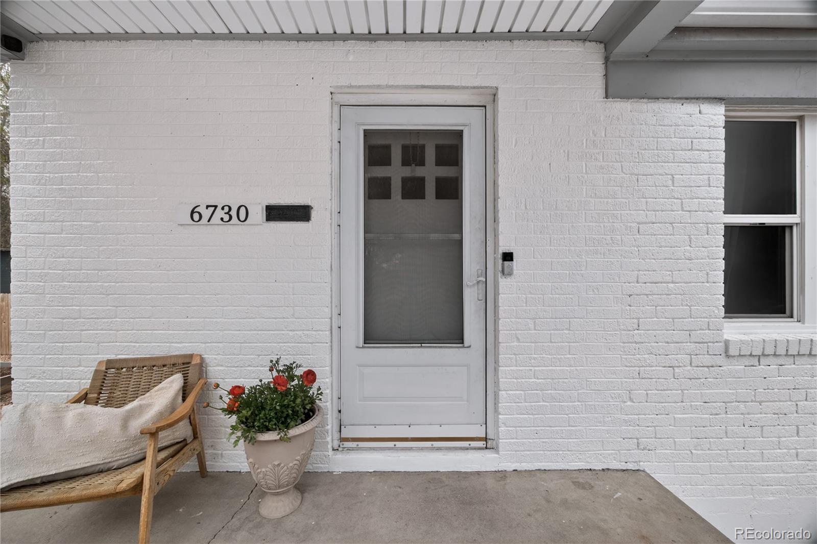 6730 Oneida Street Commerce City, CO 80022 - Photo 29 of 37 a view of a entryway door of the house