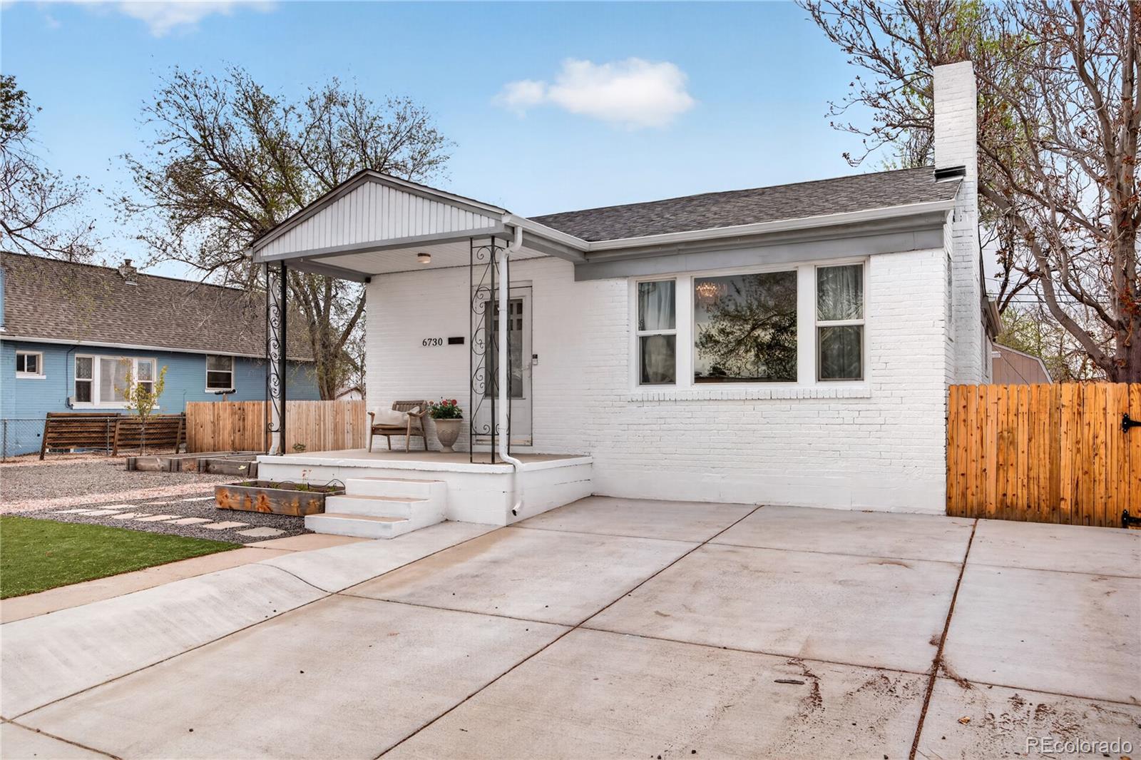 6730 Oneida Street Commerce City, CO 80022 - Photo 33 of 37 a backyard of a house with seating space