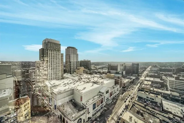 a view of city with tall buildings