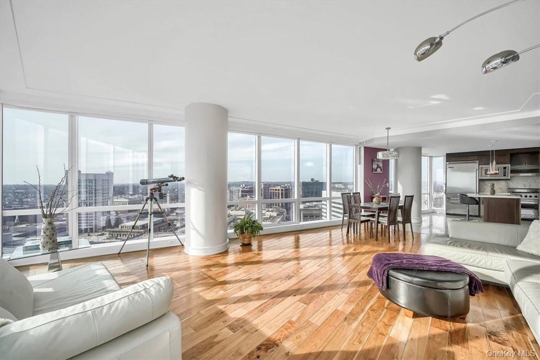 1 Renaissance Square, Unit 20C White Plains, NY 10601 - Photo 4 of 13 a living room with furniture and a large window