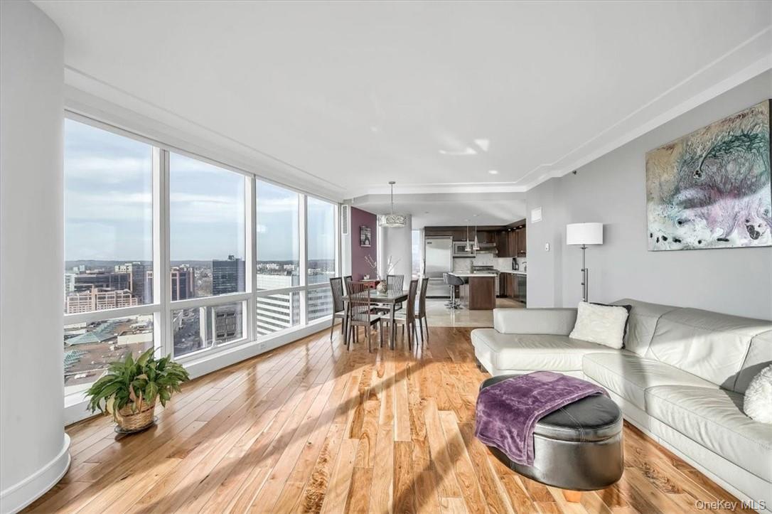 1 Renaissance Square, Unit 20C White Plains, NY 10601 - Photo 5 of 13 a living room with furniture and a large window