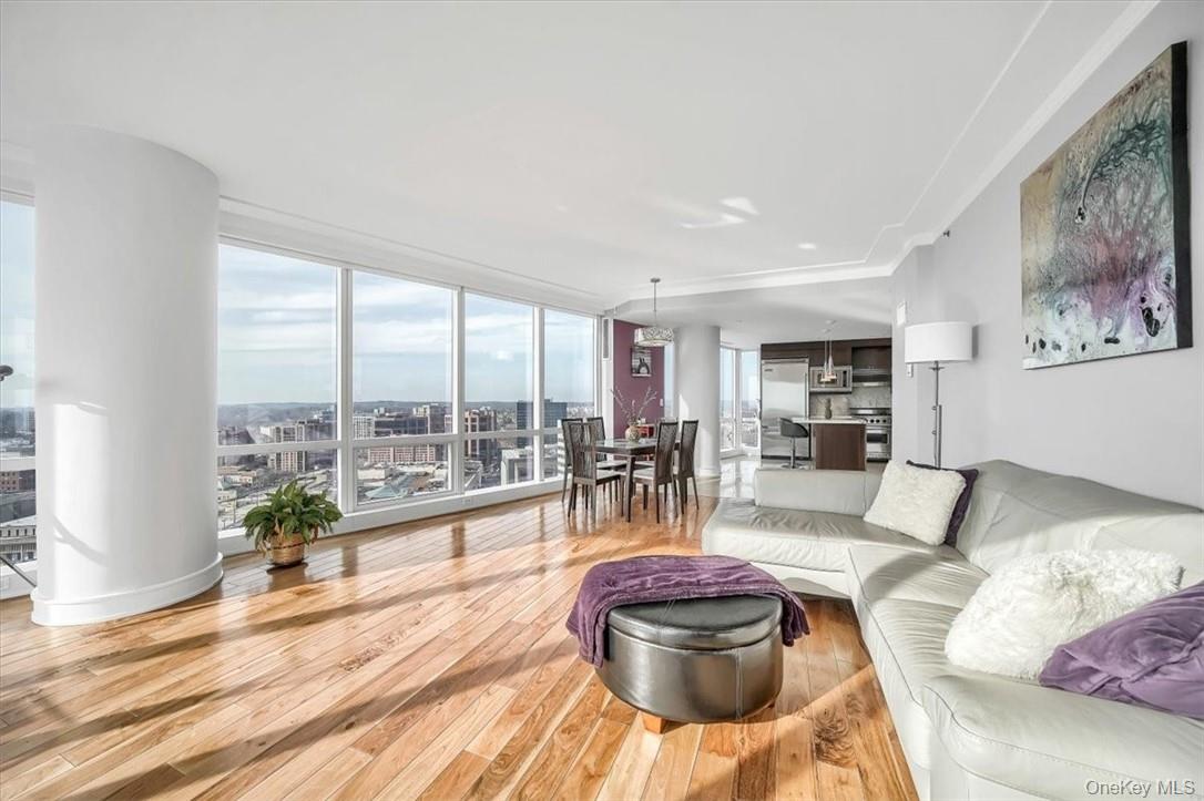 1 Renaissance Square, Unit 20C White Plains, NY 10601 - Photo 7 of 13 a living room with furniture and a large window