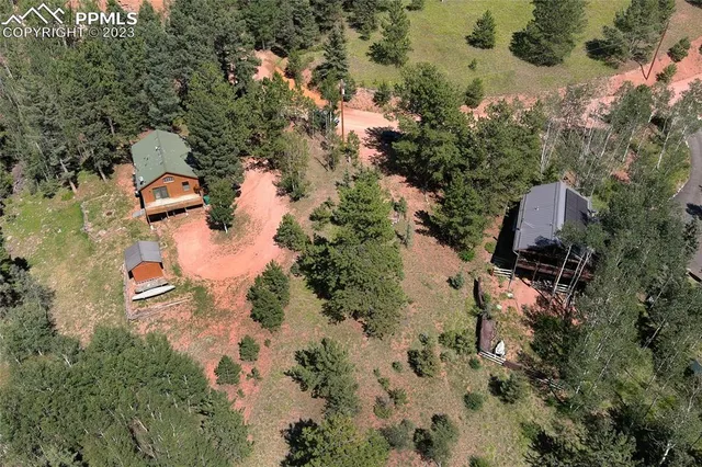 an aerial view of residential house with outdoor space