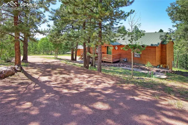 a backyard of a house with lots of green space