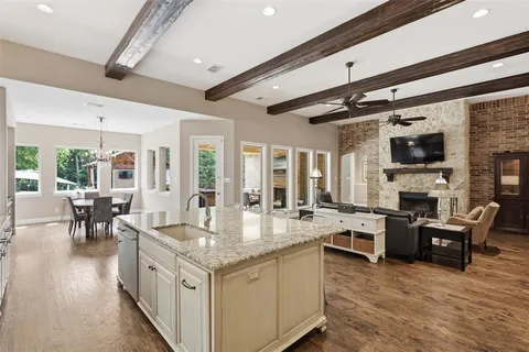 a open kitchen with stainless steel appliances granite countertop a stove and cabinets