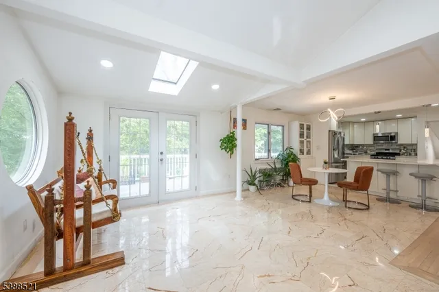 a view of a livingroom with furniture and a potted plant