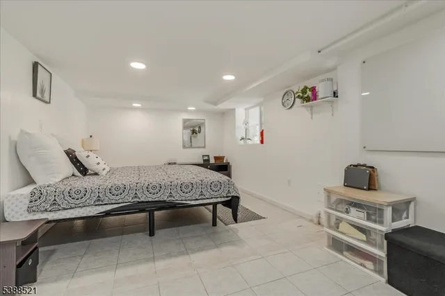 a spacious bedroom with a bed and furniture