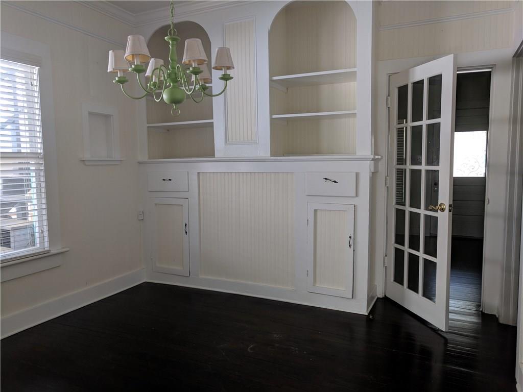 412 Southwest California Avenue Stuart, FL 34994 - Photo 23 of 46 wooden floor in an empty room with a window