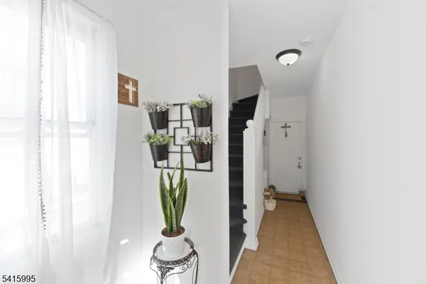 a view of a hallway with living room