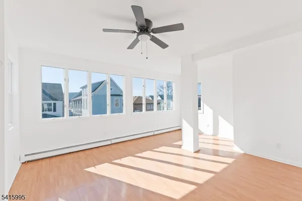 a front view of a house with a ceiling fan