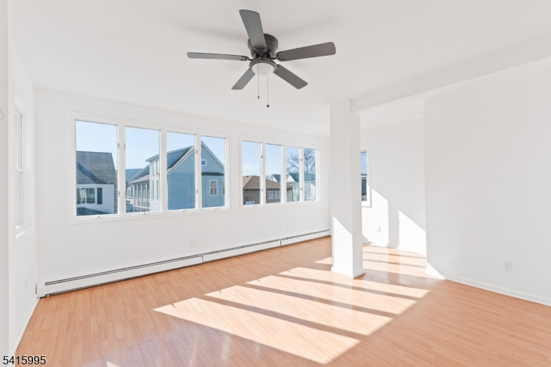 118 Ray Street Garfield, NJ 07026 - Photo 3 of 15 a front view of a house with a ceiling fan
