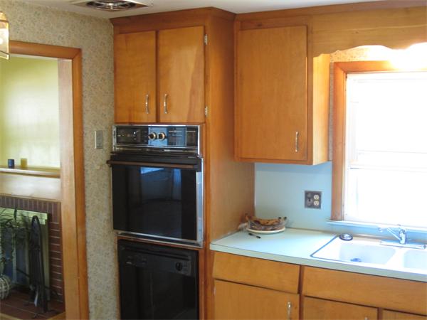 172 Bacon Road Springfield, MA 01119 - Photo 7 of 17 a kitchen with a refrigerator and a sink
