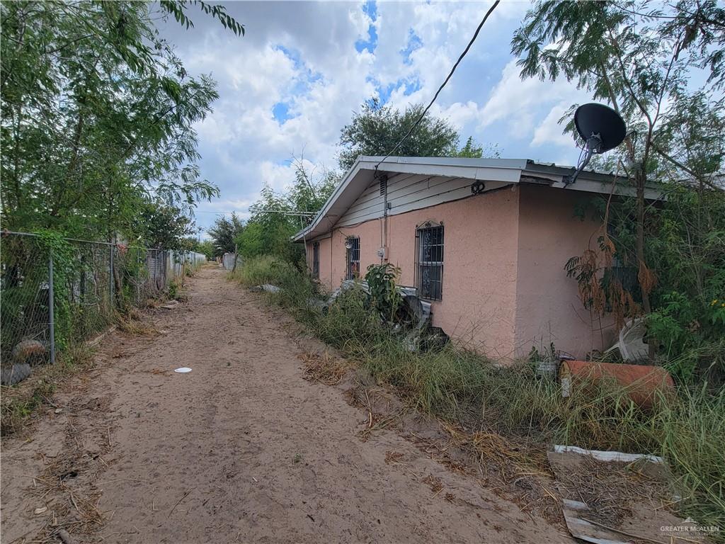 159 Guadalupe Flores Road Sullivan City, TX 78595 - Photo 2 of 5 a house with trees in the background