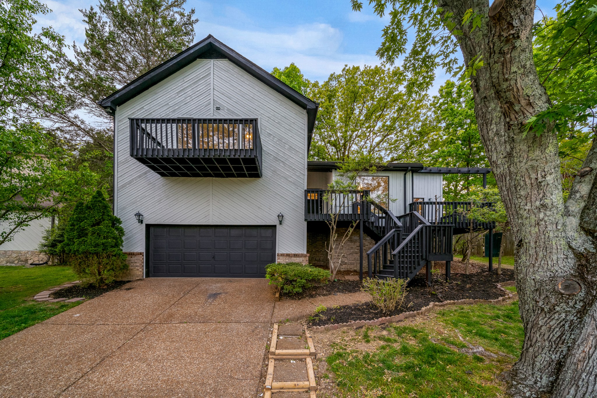 2417 Ravine Drive Nashville, TN 37217 - Photo 1 of 29 a front view of a house with garden