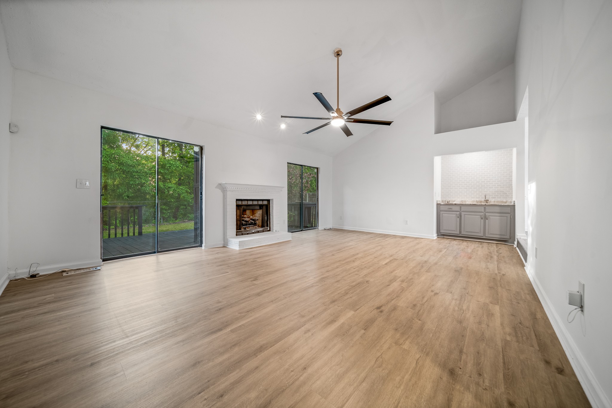 2417 Ravine Drive Nashville, TN 37217 - Photo 11 of 29 a view of empty room with wooden floor and fireplace