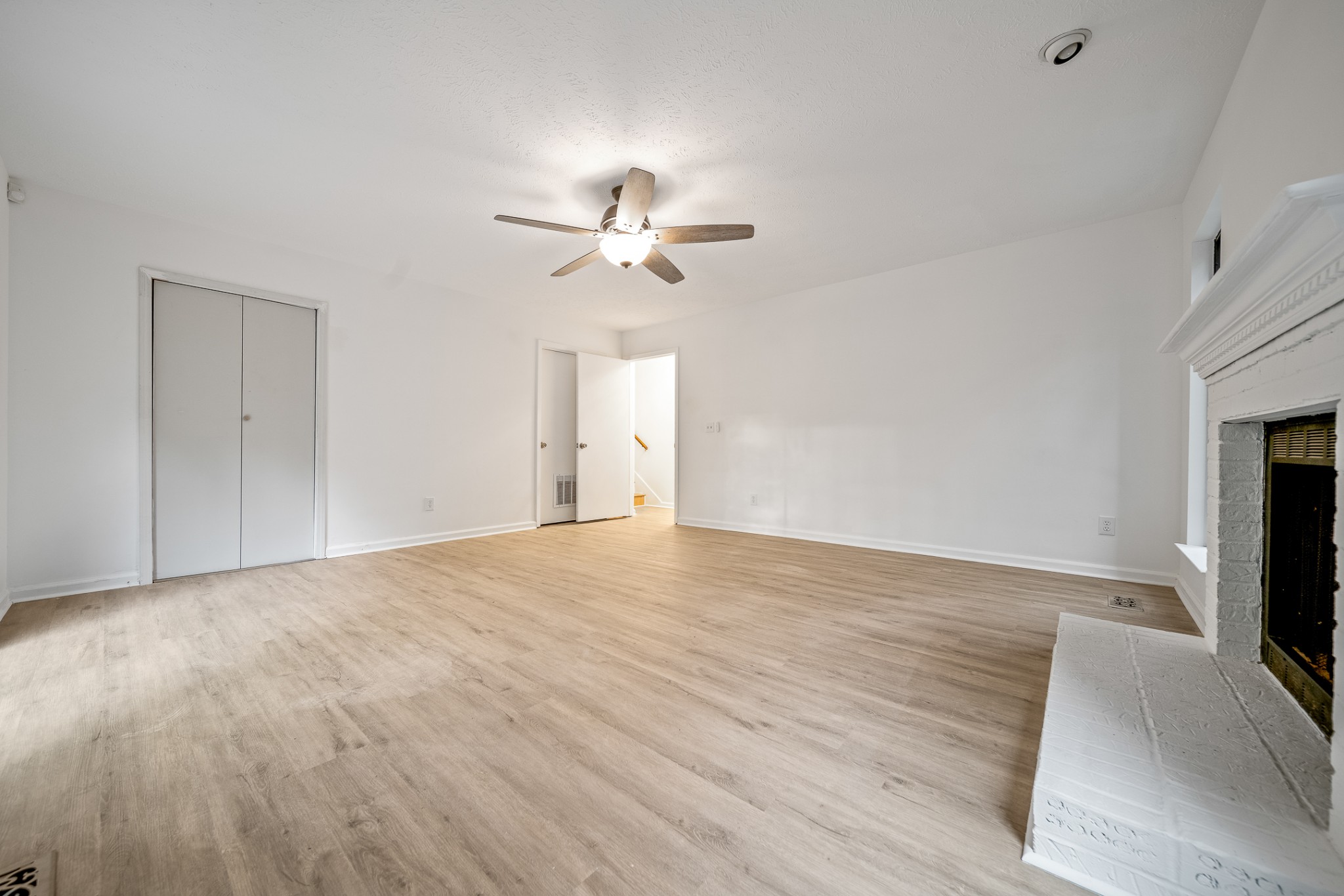 2417 Ravine Drive Nashville, TN 37217 - Photo 15 of 29 a view of an empty room with a window and a kitchen
