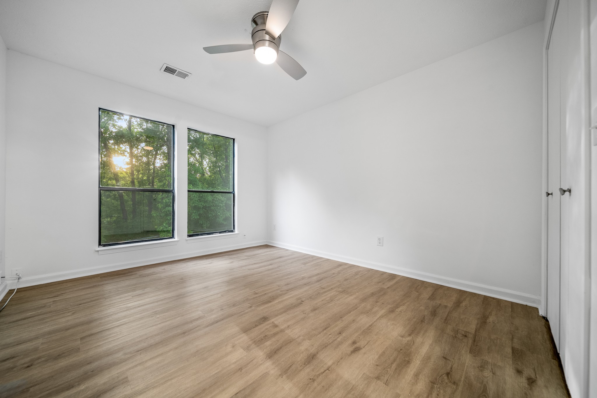 2417 Ravine Drive Nashville, TN 37217 - Photo 17 of 29 a view of an empty room with wooden floor and a window