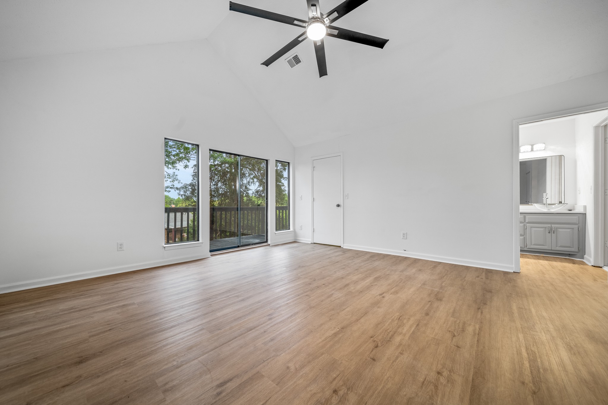 2417 Ravine Drive Nashville, TN 37217 - Photo 19 of 29 a view of an empty room with a window and wooden floor