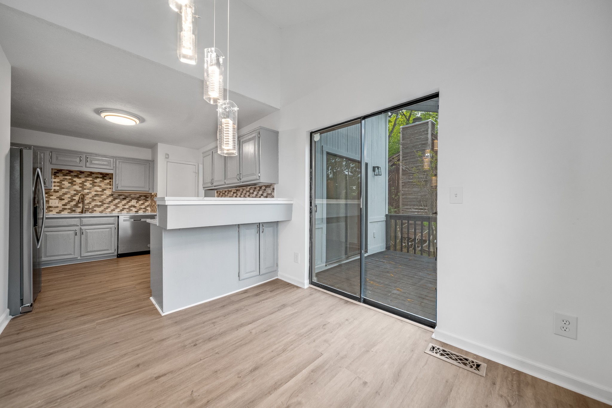 2417 Ravine Drive Nashville, TN 37217 - Photo 5 of 29 a view of a hallway to kitchen and dining room with wooden floor