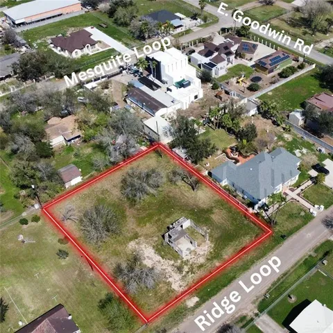 a street sign on a sidewalk next to a road