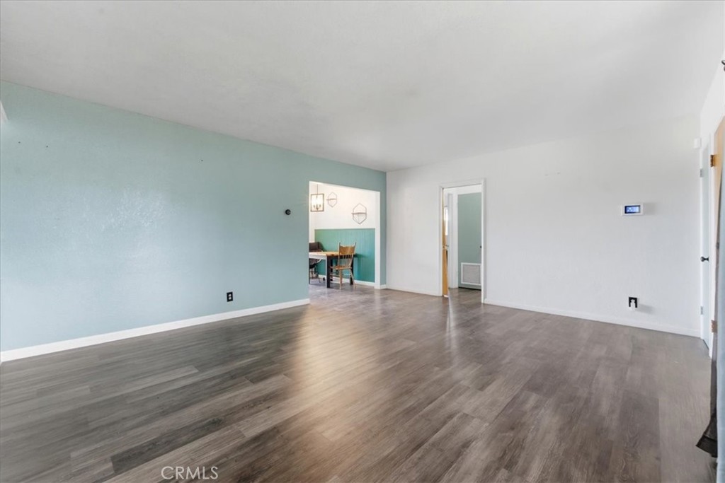 34863 Wildwood Canyon Road Yucaipa, CA 92399 - Photo 4 of 22 a view of empty room with wooden floor