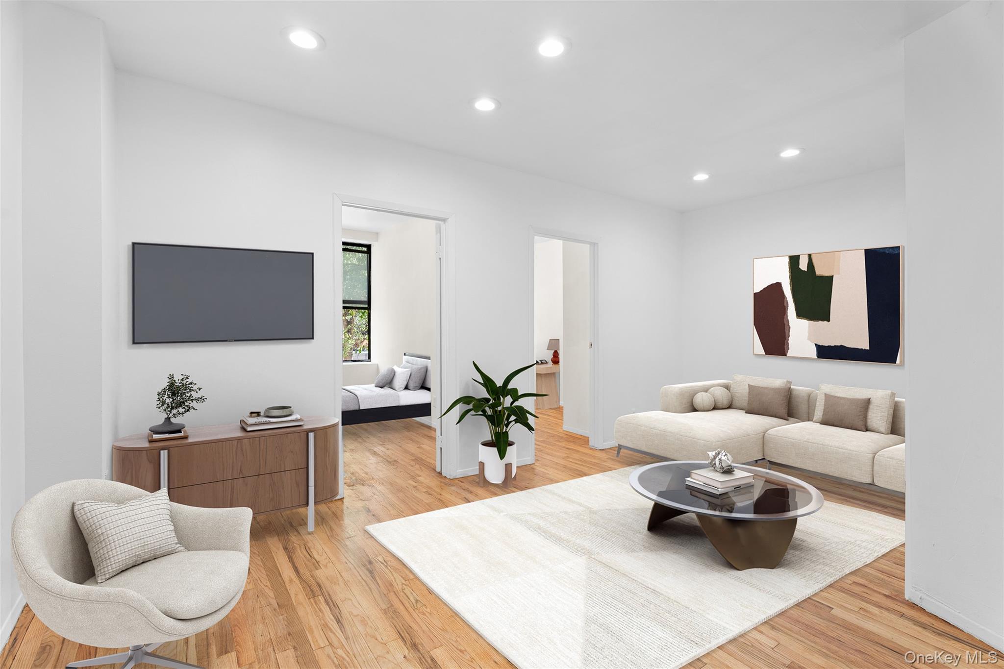 246 East 51st Street, Unit 7 Manhattan, NY 10022 - Photo 2 of 9 a living room with furniture and a flat screen tv