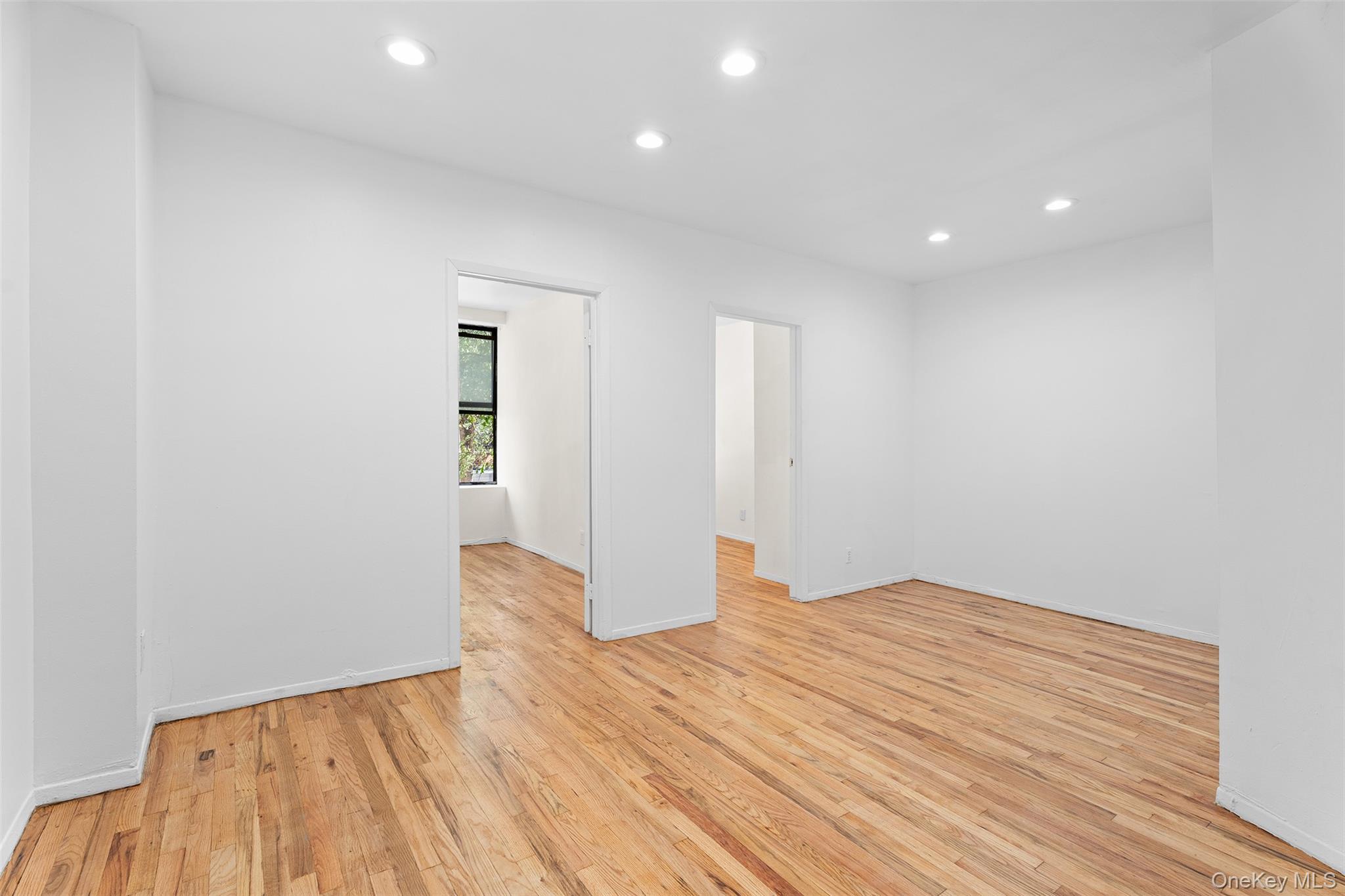 246 East 51st Street, Unit 7 Manhattan, NY 10022 - Photo 3 of 9 a view of empty room with wooden floor
