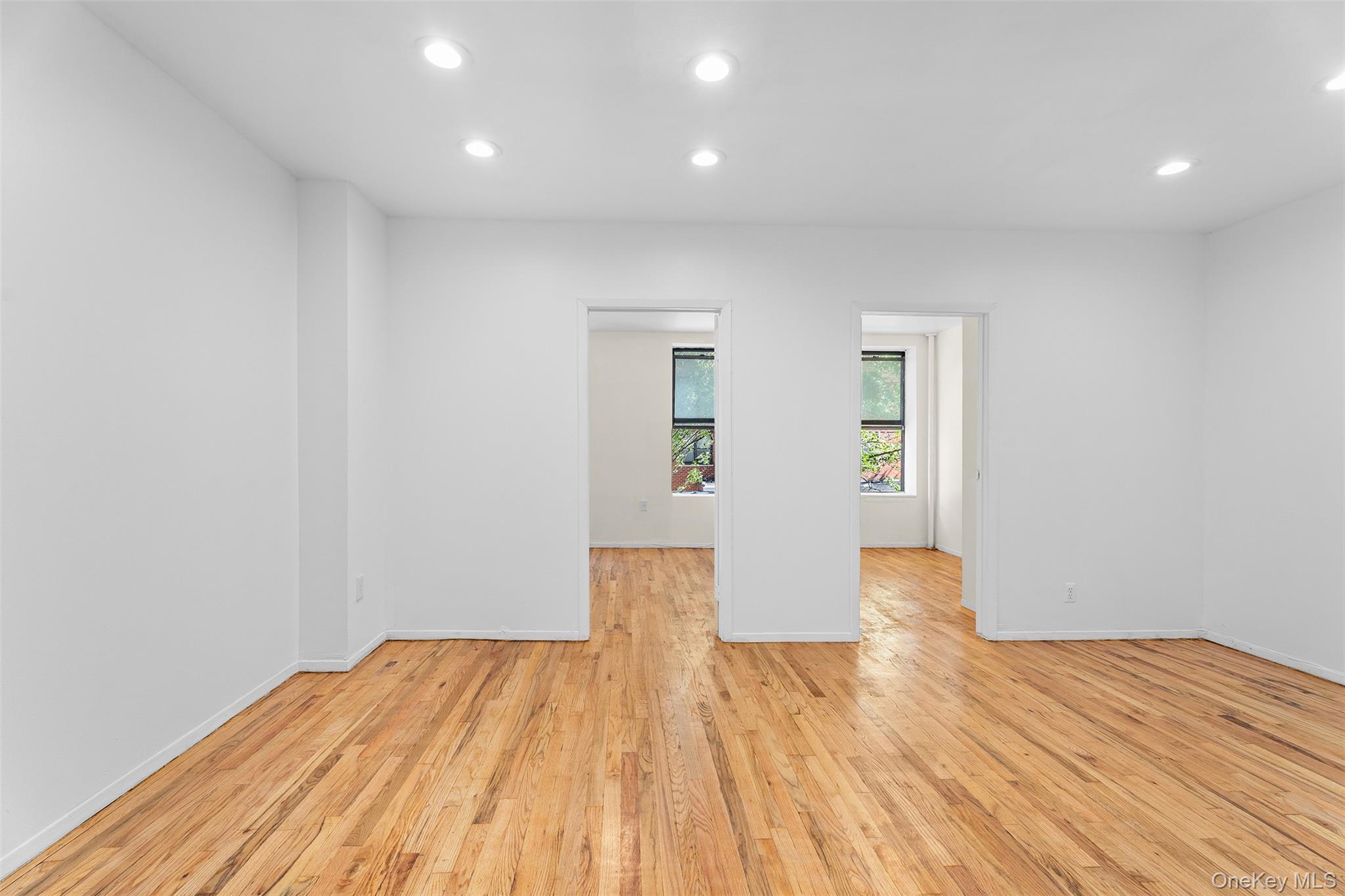 246 East 51st Street, Unit 7 Manhattan, NY 10022 - Photo 4 of 9 a view of empty room with wooden floor