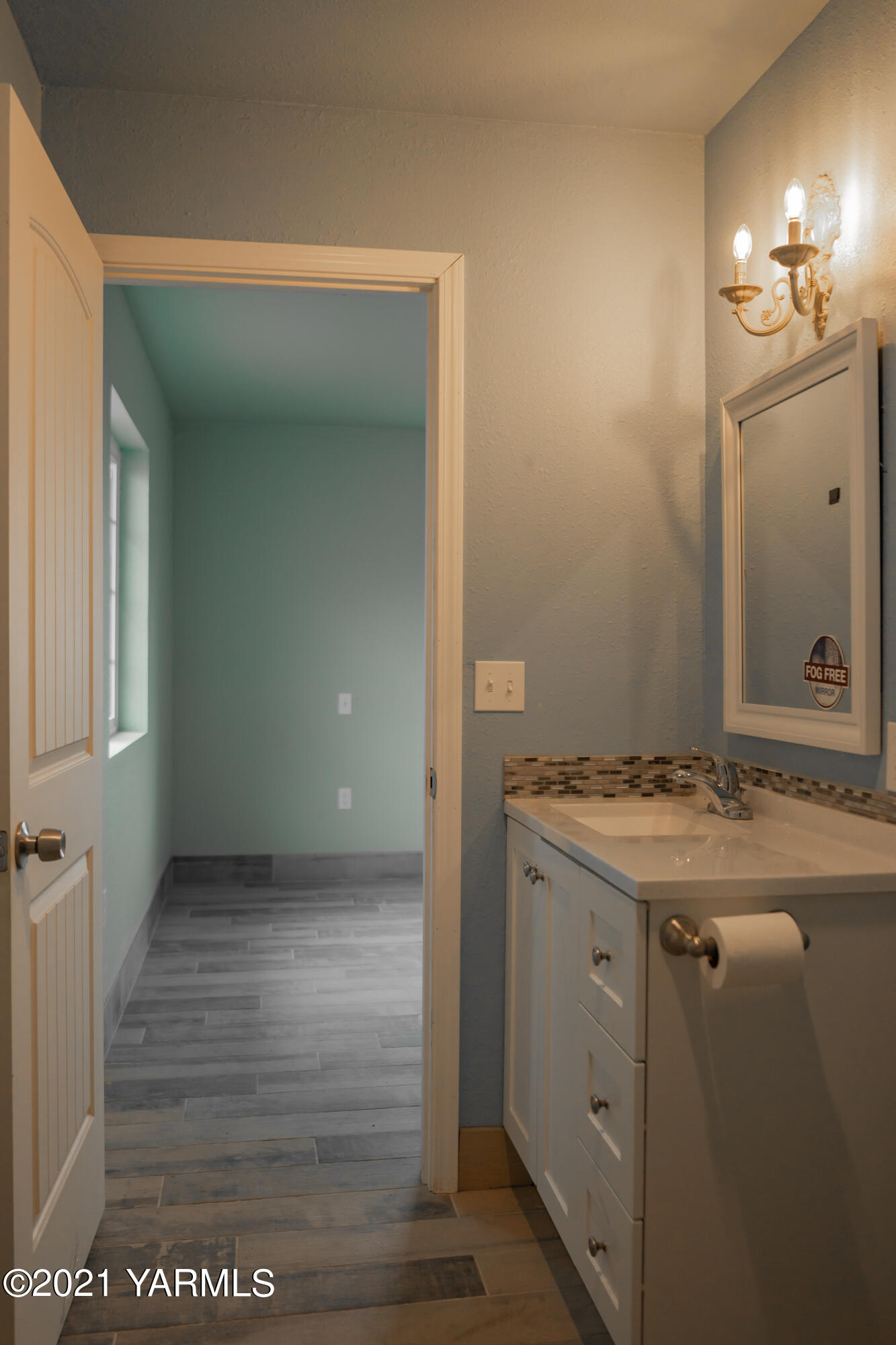 281 Starview Road Yakima, WA 98908 - Photo 15 of 26 a bathroom with a granite countertop sink and a mirror