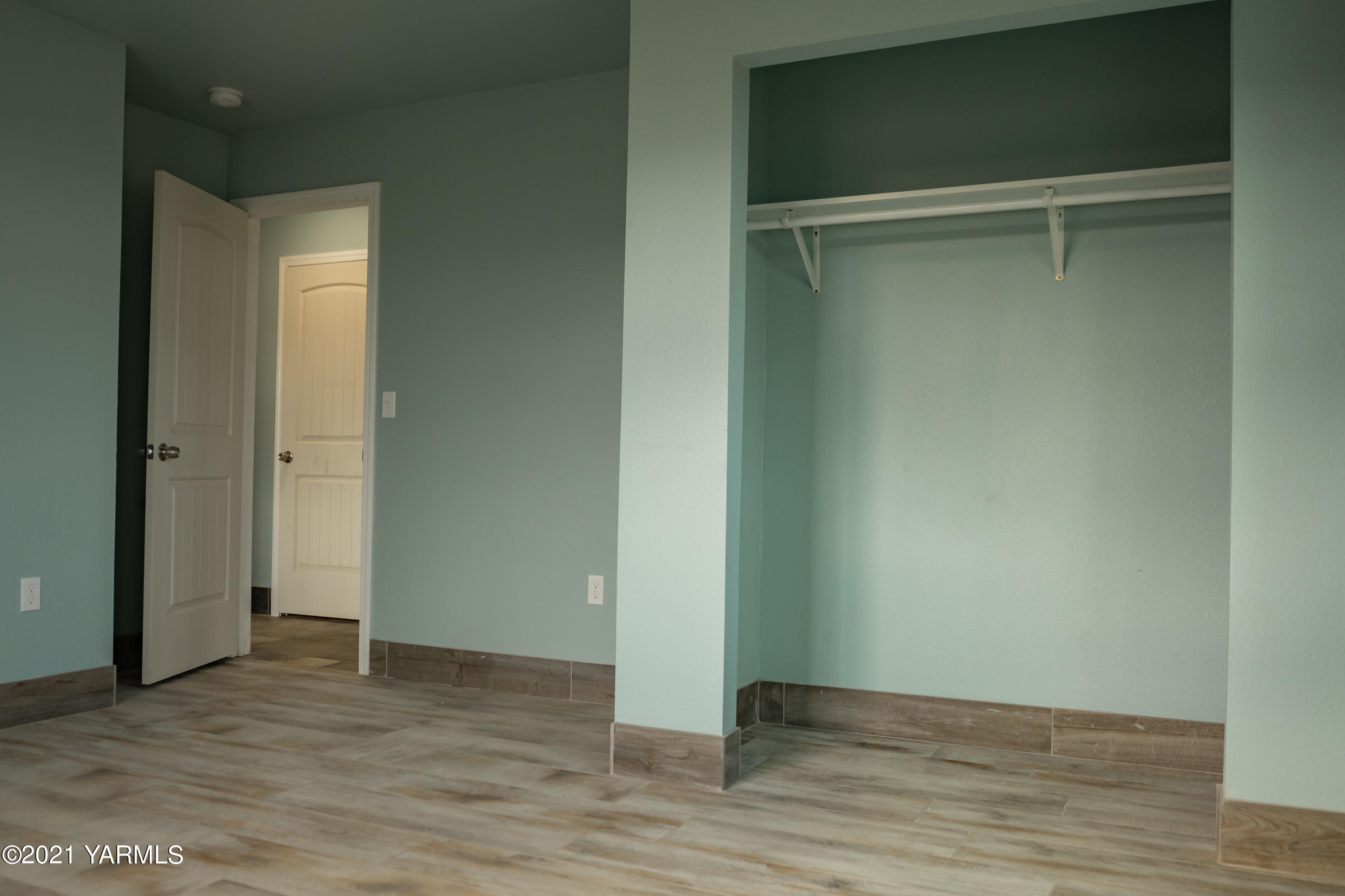 281 Starview Road Yakima, WA 98908 - Photo 19 of 26 a view of an empty room with wooden floor