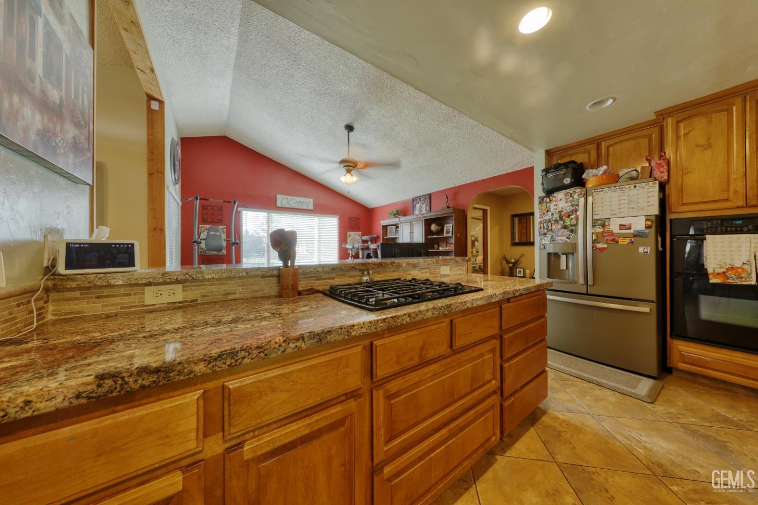 Undisclosed Address Bakersfield, CA 93308 - Photo 17 of 64 a kitchen with stainless steel appliances granite countertop a stove a sink and a refrigerator