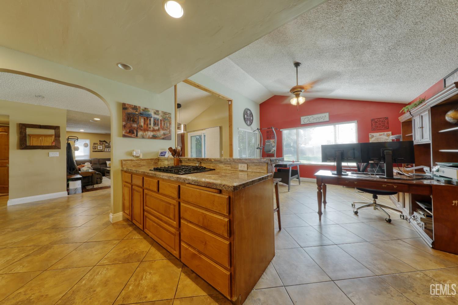 Undisclosed Address Bakersfield, CA 93308 - Photo 18 of 64 a kitchen with a sink counter top space and a view of living room