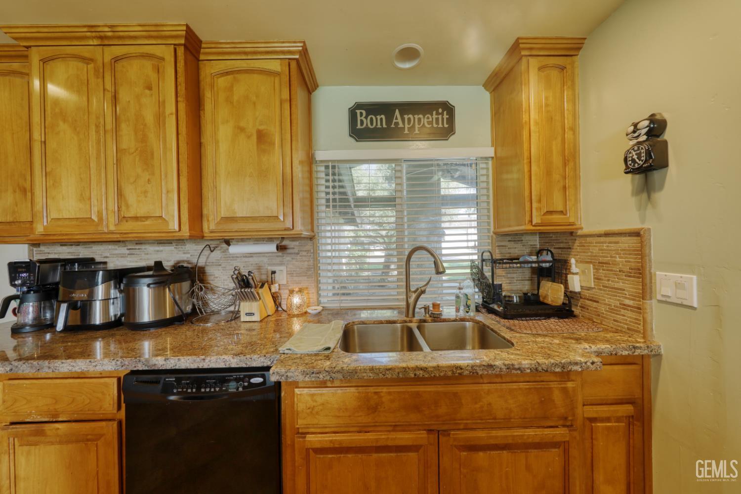Undisclosed Address Bakersfield, CA 93308 - Photo 19 of 64 a kitchen with sink cabinets and window