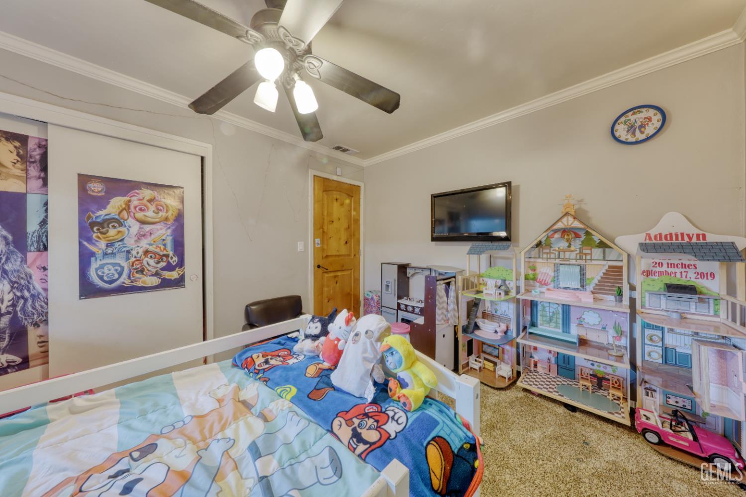 Undisclosed Address Bakersfield, CA 93308 - Photo 34 of 64 a bedroom with furniture and a flat screen tv