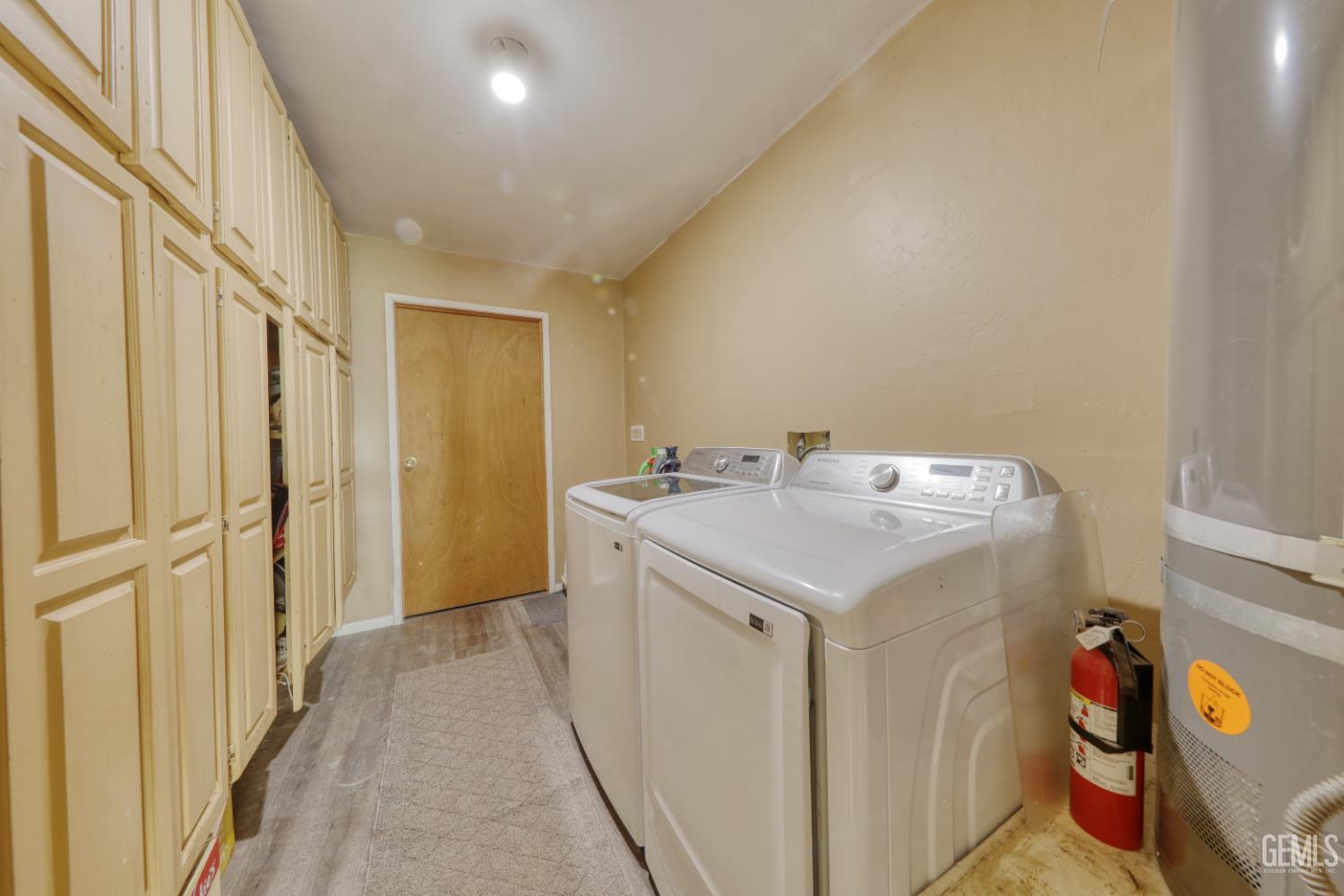 Undisclosed Address Bakersfield, CA 93308 - Photo 42 of 64 a utility room with a sink dryer and washer
