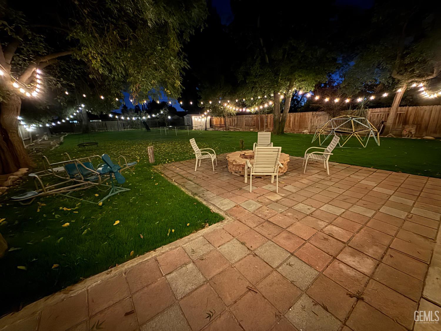 Undisclosed Address Bakersfield, CA 93308 - Photo 44 of 64 a view of a table and chairs in patio with a yard