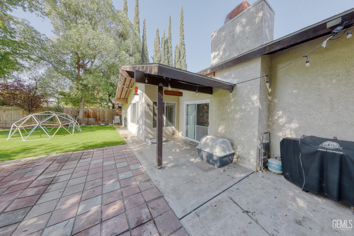 Undisclosed Address Bakersfield, CA 93308 - Photo 49 of 64 a front view of a house with garden
