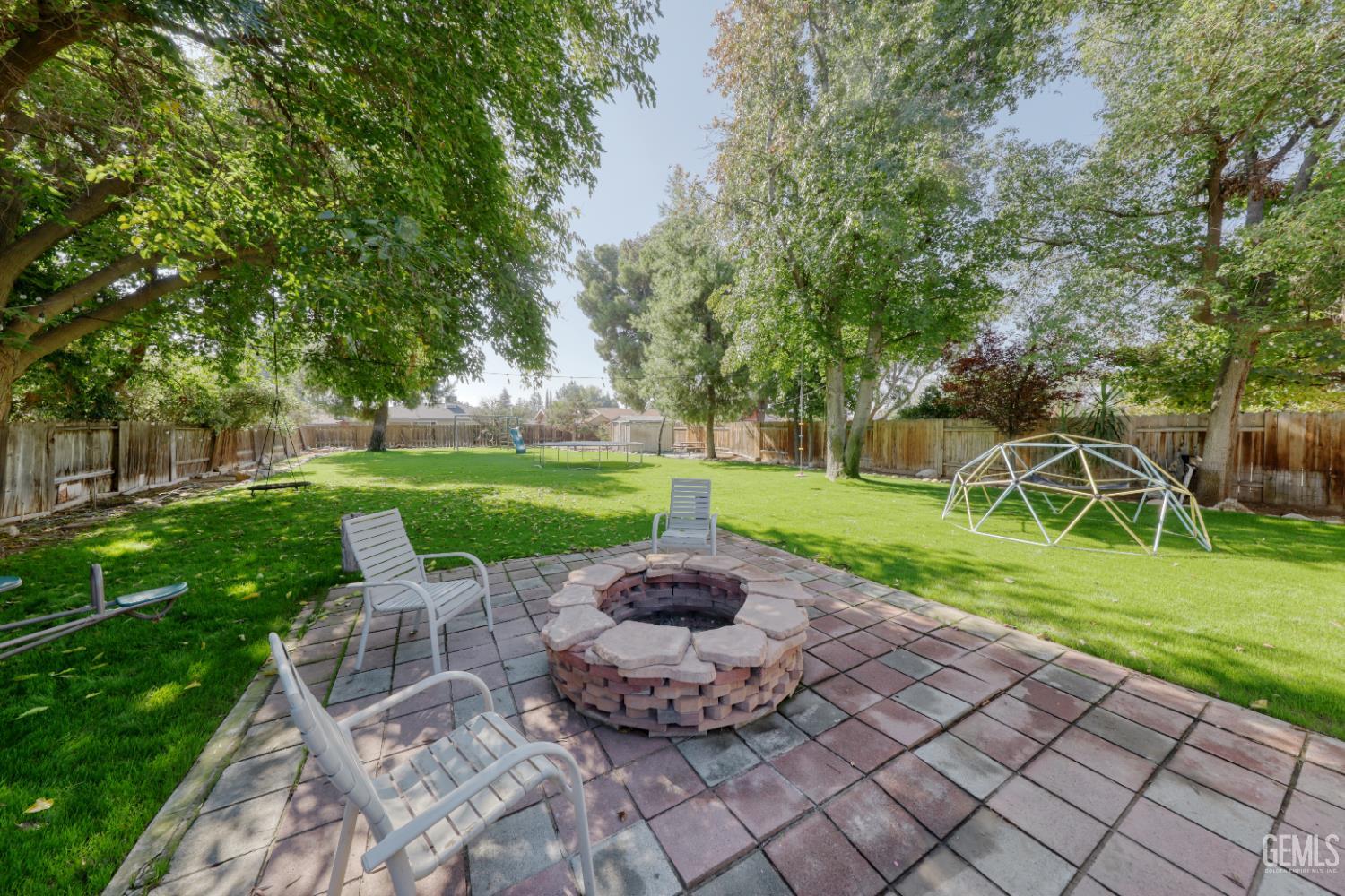 Undisclosed Address Bakersfield, CA 93308 - Photo 50 of 64 a view of a backyard with sitting area