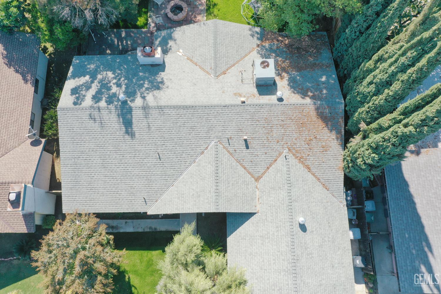 Undisclosed Address Bakersfield, CA 93308 - Photo 59 of 64 an aerial view of a house with a yard and large trees