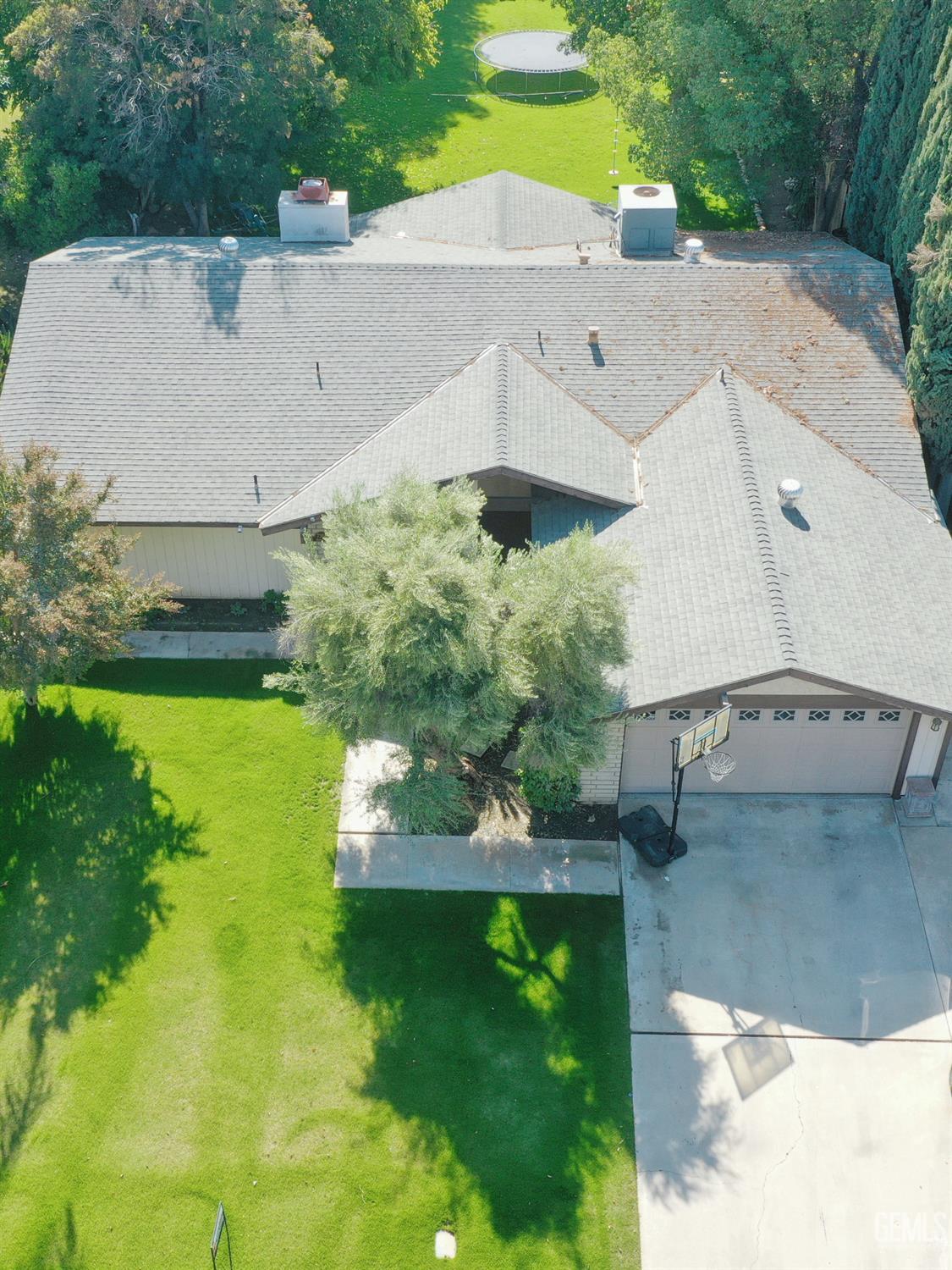 Undisclosed Address Bakersfield, CA 93308 - Photo 60 of 64 a view of a house with a yard