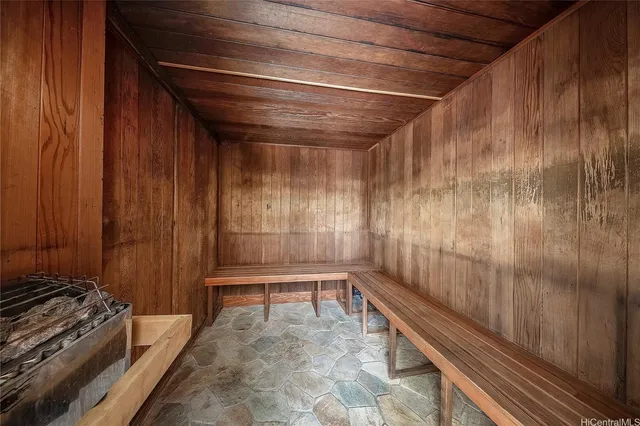 a view of a room with wooden walls