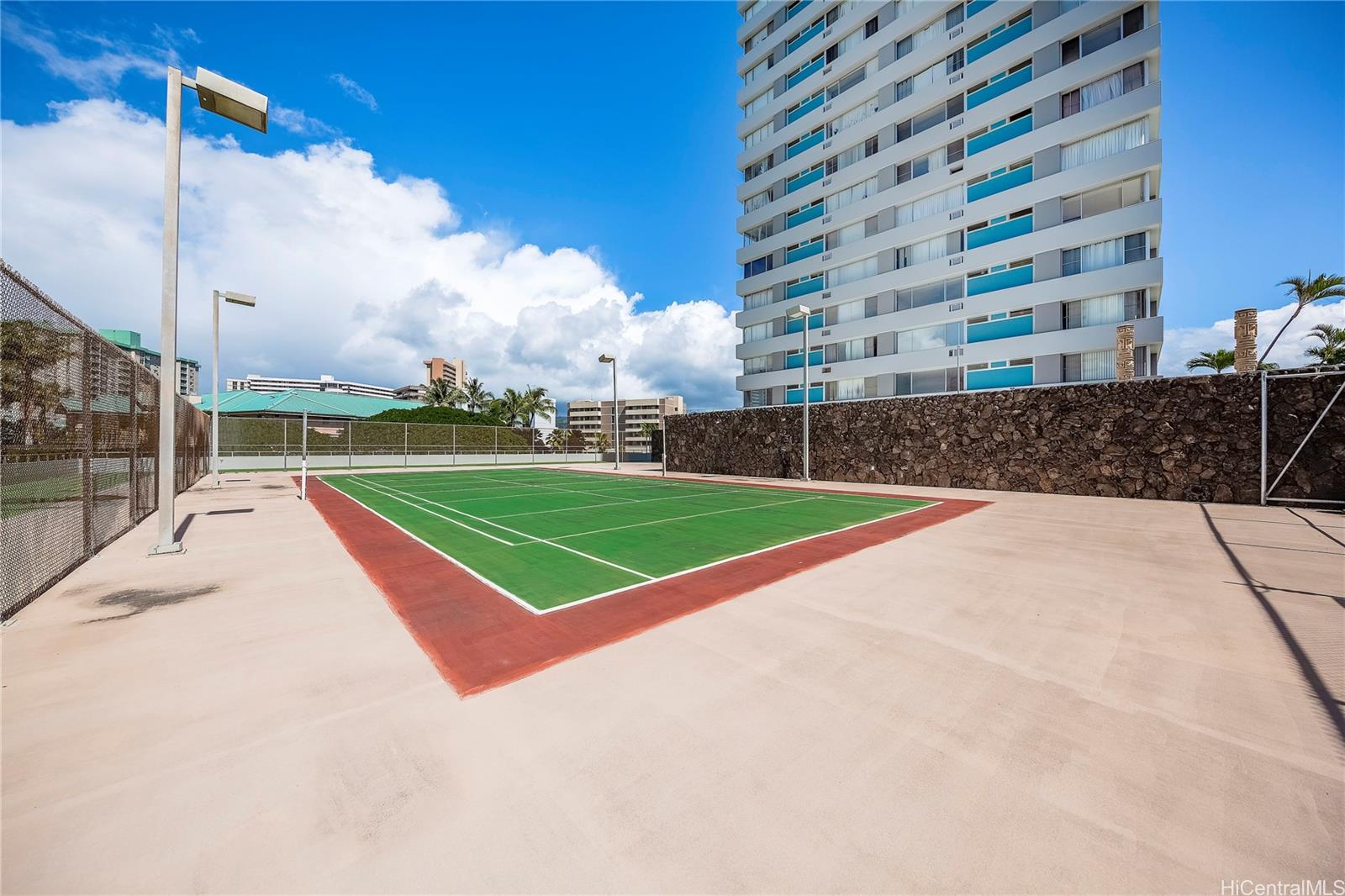 2888 Ala Ilima Street, Unit 1901 Honolulu, HI 96818 - Photo 12 of 14 a view of a tennis ground with a large building in the background