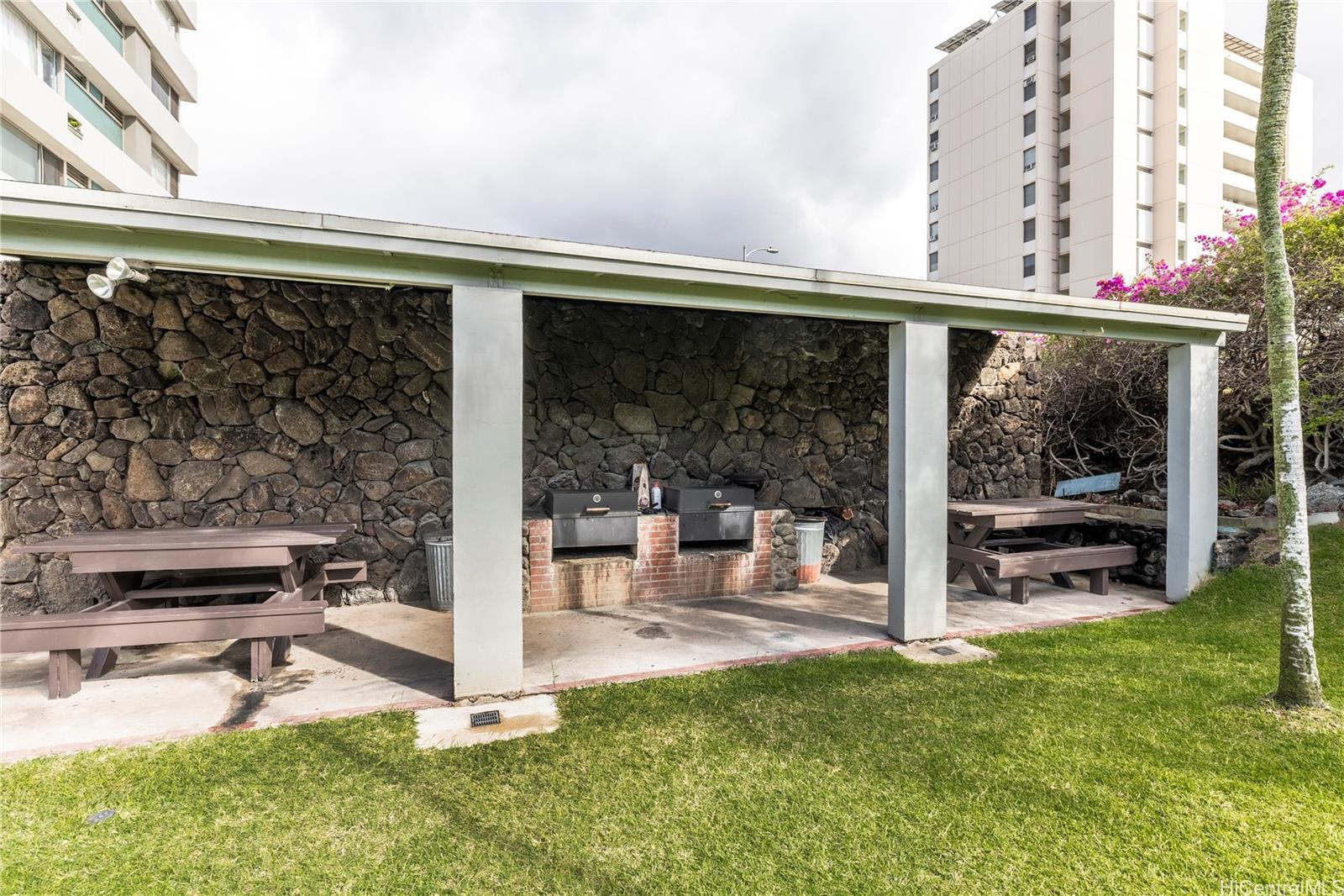 2888 Ala Ilima Street, Unit 1901 Honolulu, HI 96818 - Photo 9 of 14 a view of a patio with a table and chairs