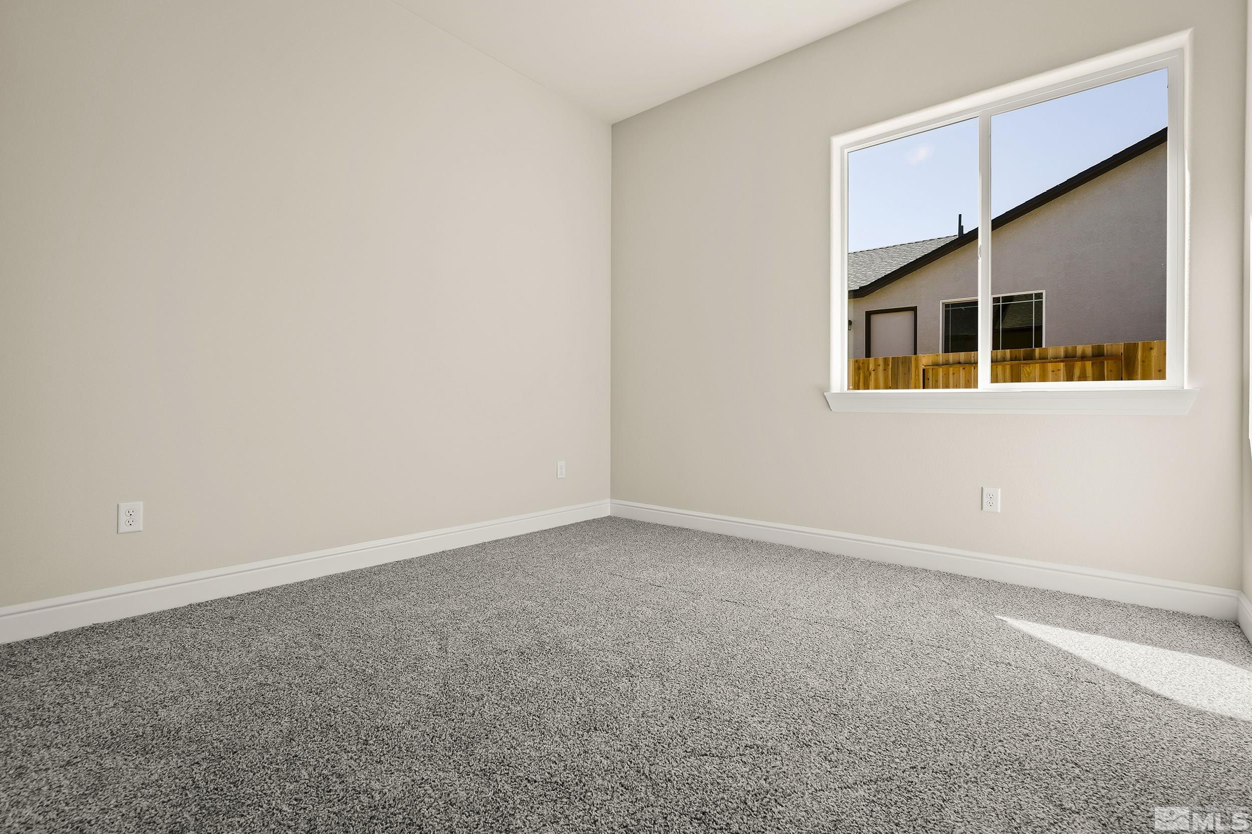 11048 Athabasca Drive Reno, NV 89506 - Photo 3 of 16 a view of an empty room with a window