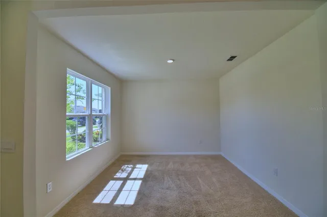 an empty room with windows